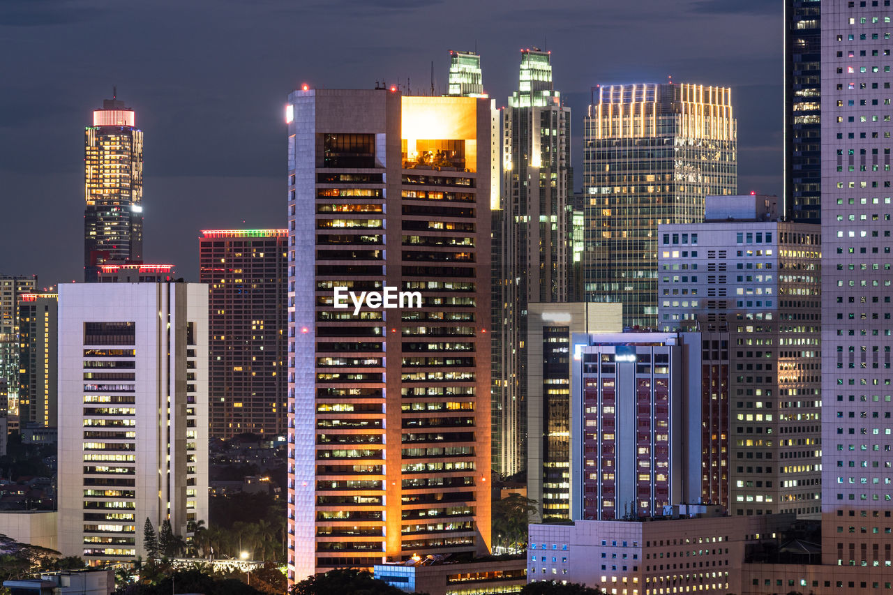 Illuminated buildings in city at night