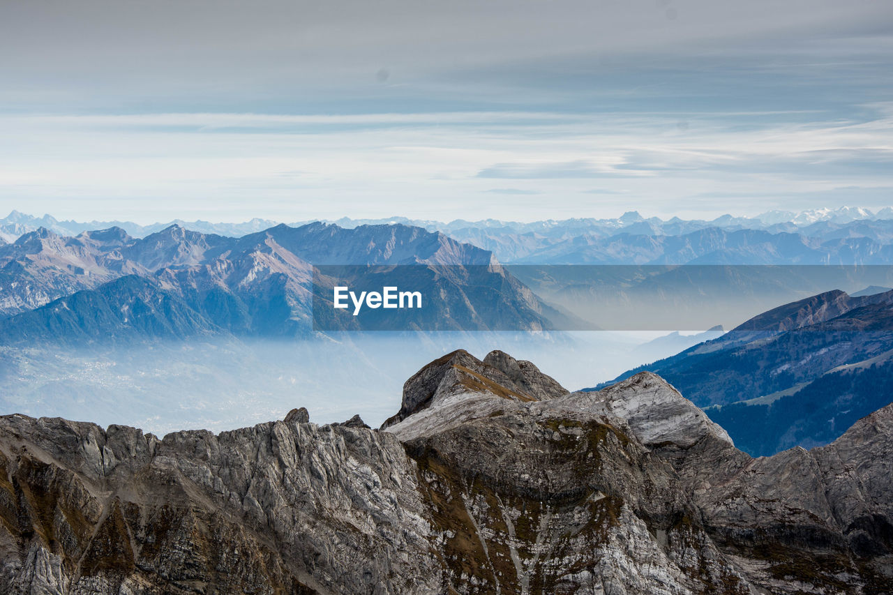 Scenic view of snowcapped mountains against sky