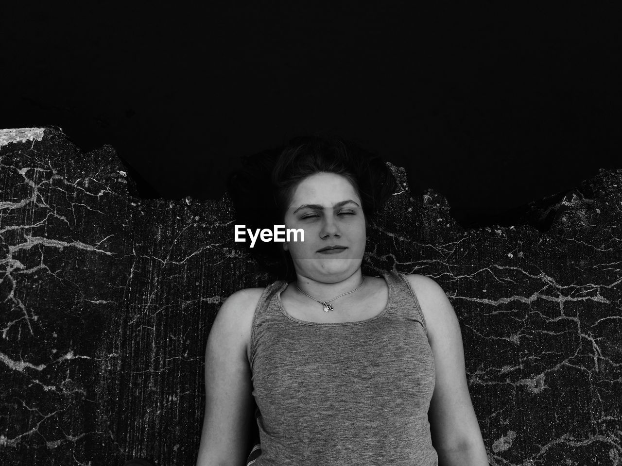 Directly above shot of teenage girl lying on floor at night
