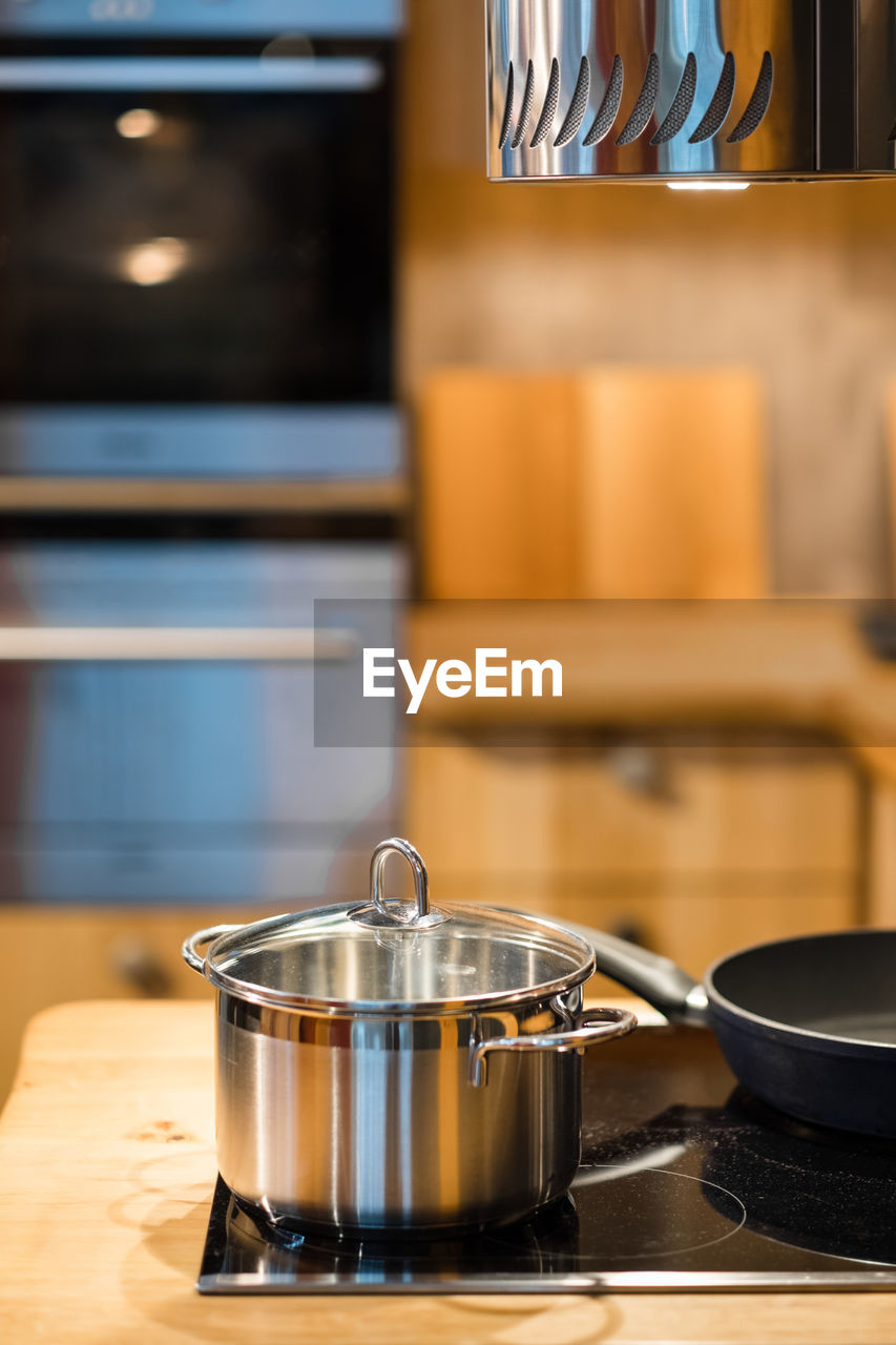 Close-up of cooking pot on stove in kitchen