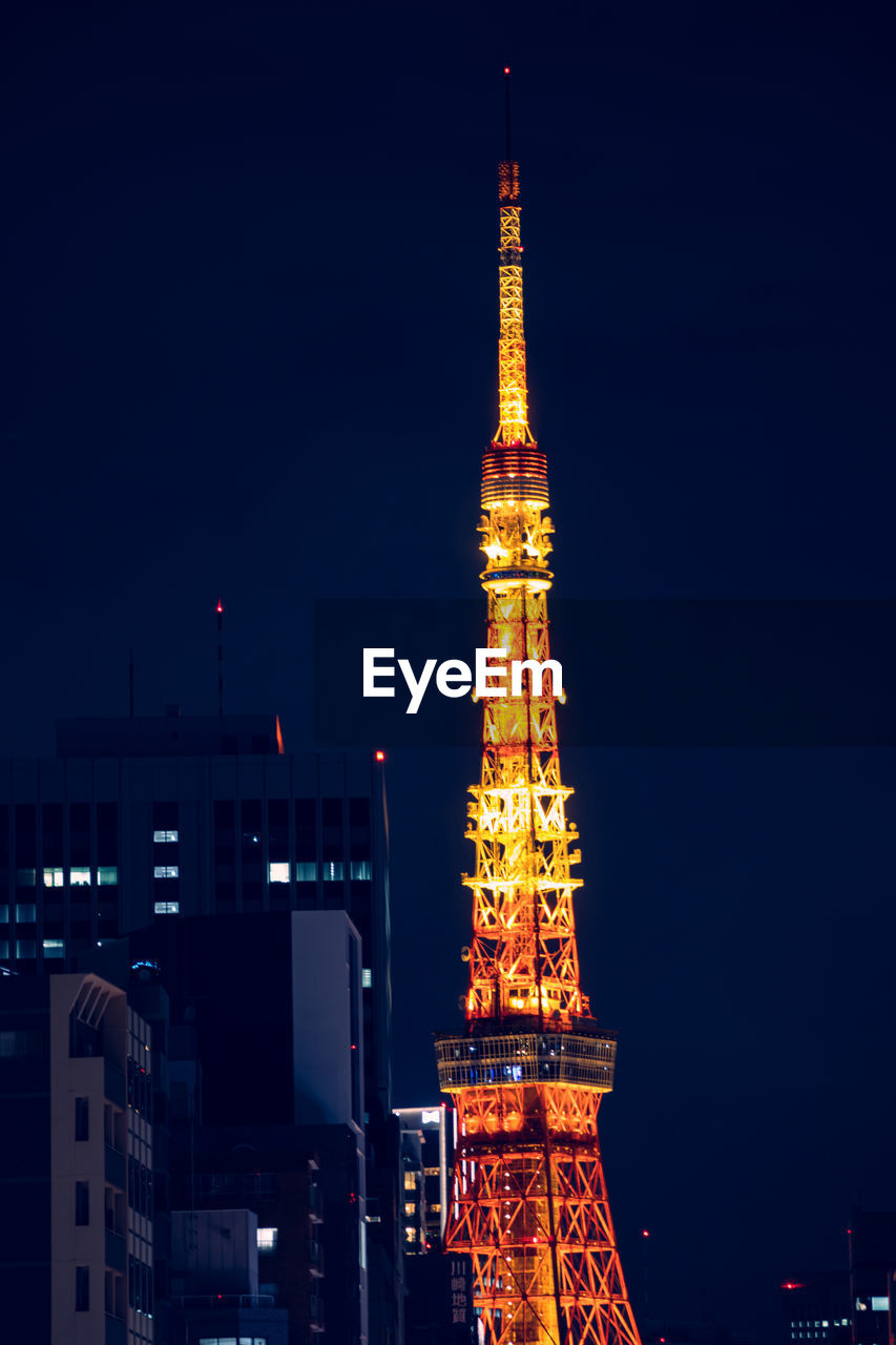 ILLUMINATED BUILDING AGAINST SKY AT NIGHT