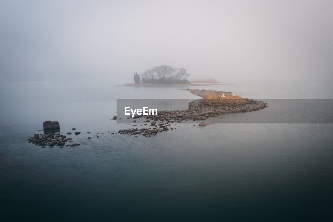 Scenic view of sea against sky during winter