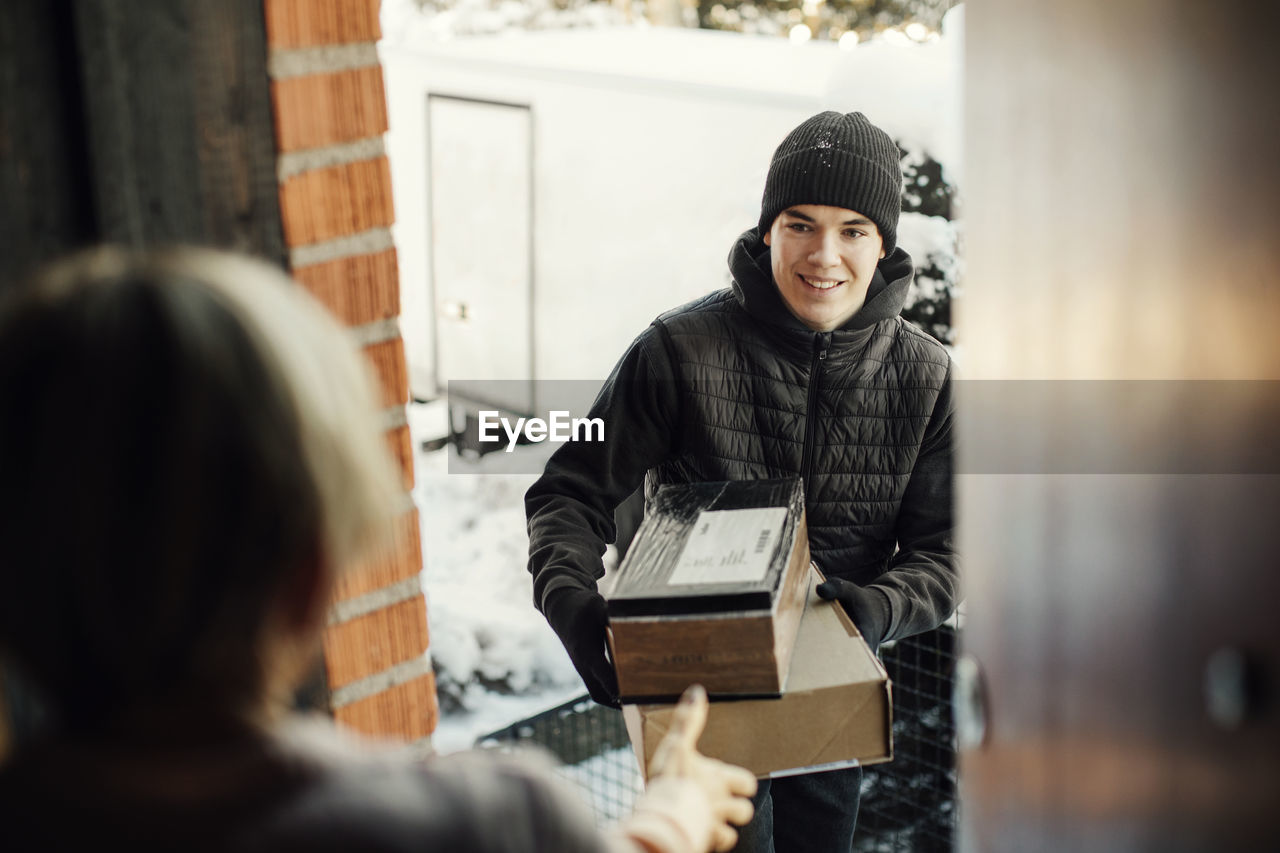 Courier delivering parcels