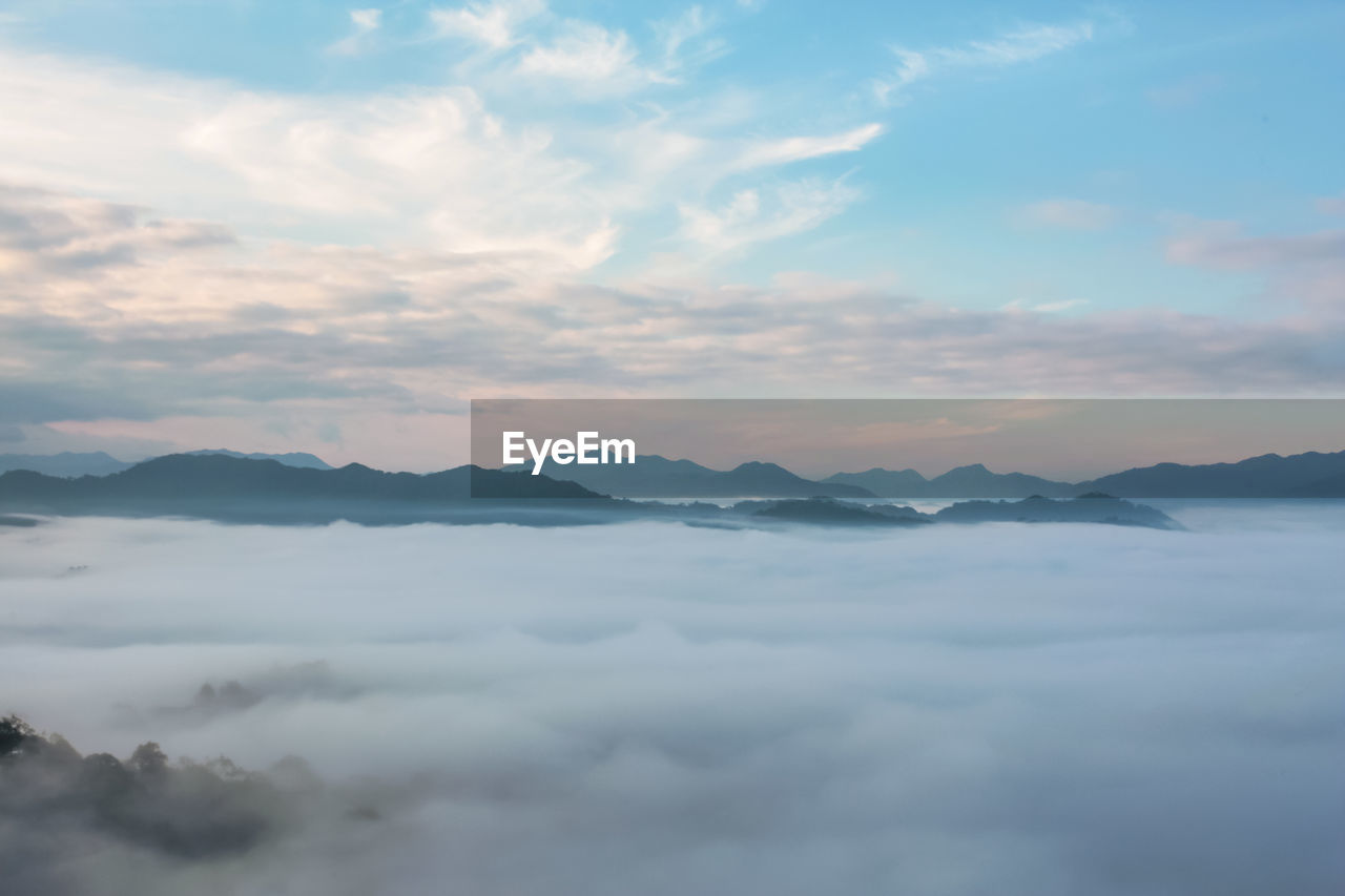 Scenic view of mountains and clouds