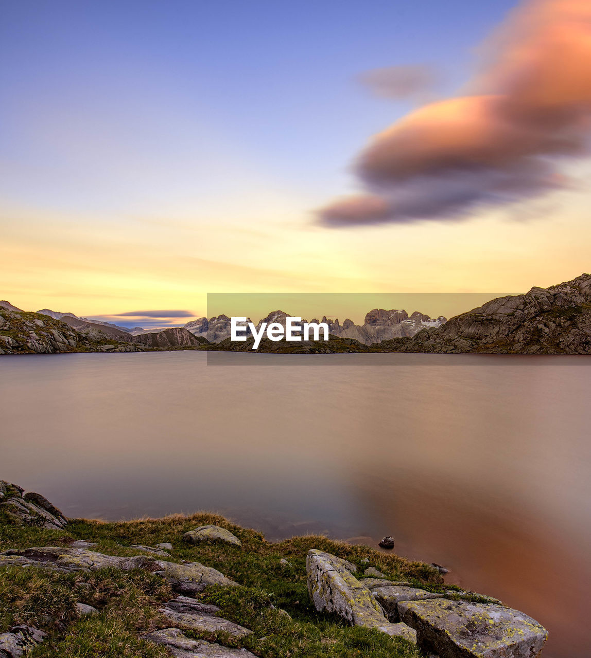 Scenic view of mountains against sky at sunset