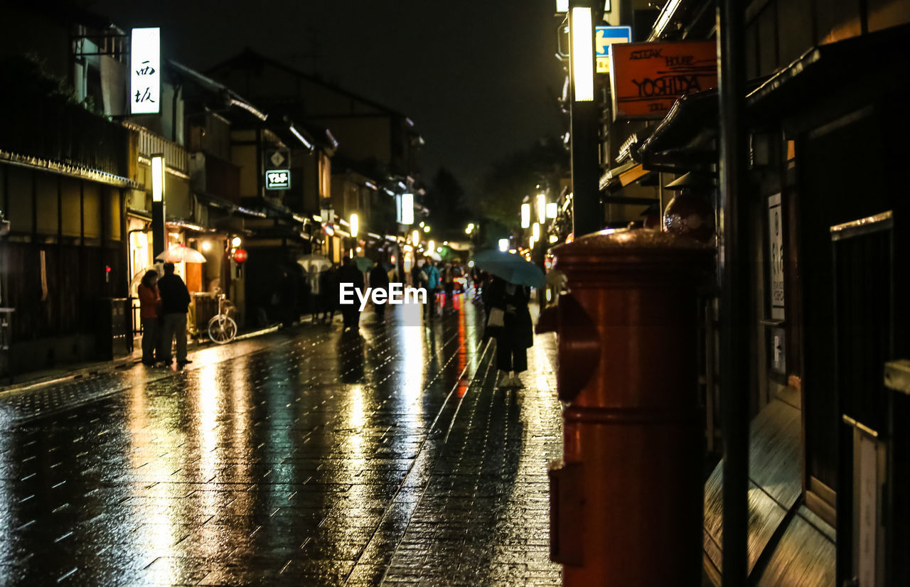 WET ILLUMINATED CITY AT NIGHT