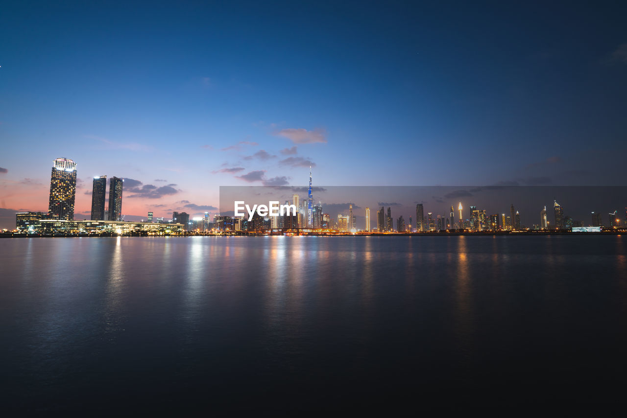 Dubai skyline during sunset dusk and night series from the water canal