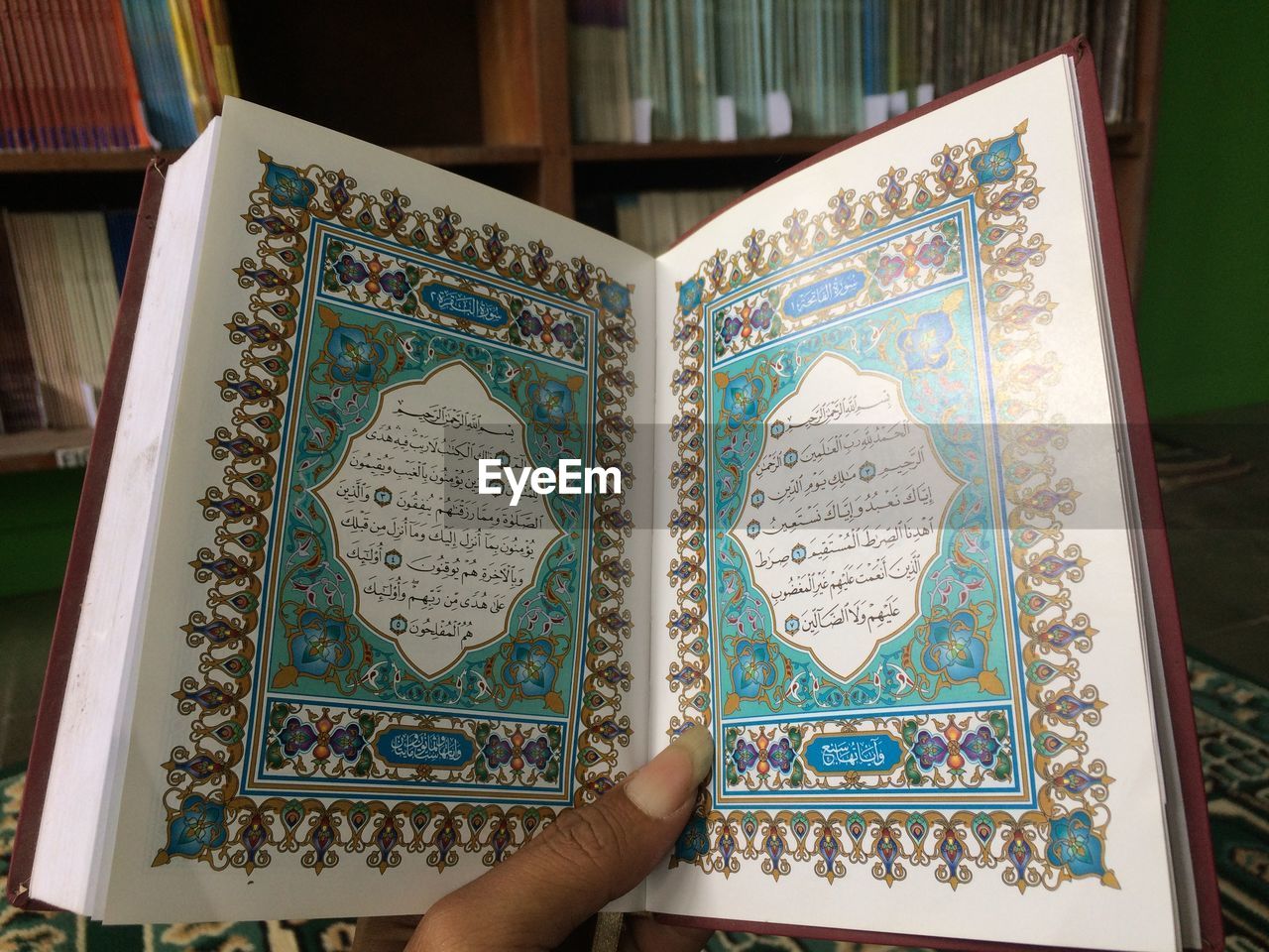 CLOSE-UP OF PERSON HOLDING BOOK