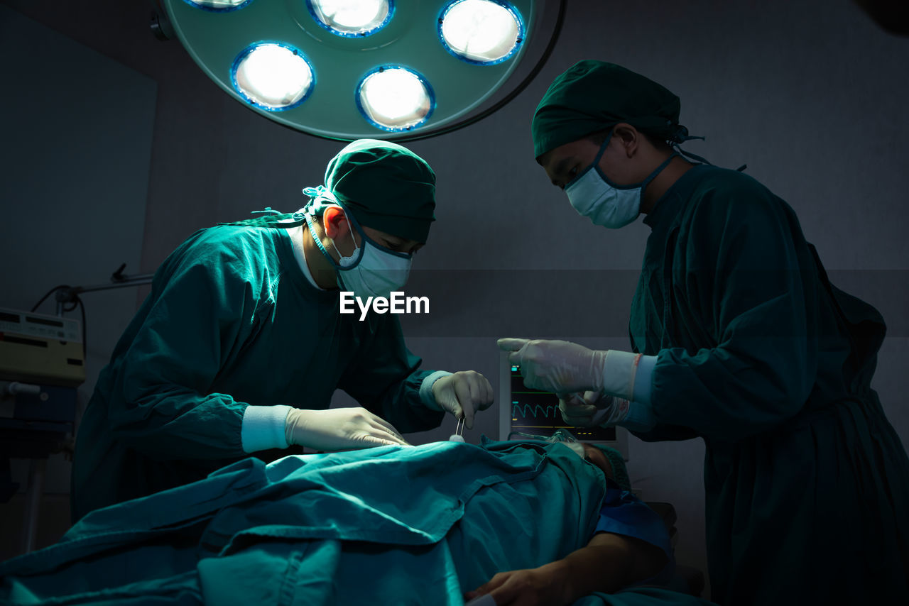 Surgeons performing surgery at operating room