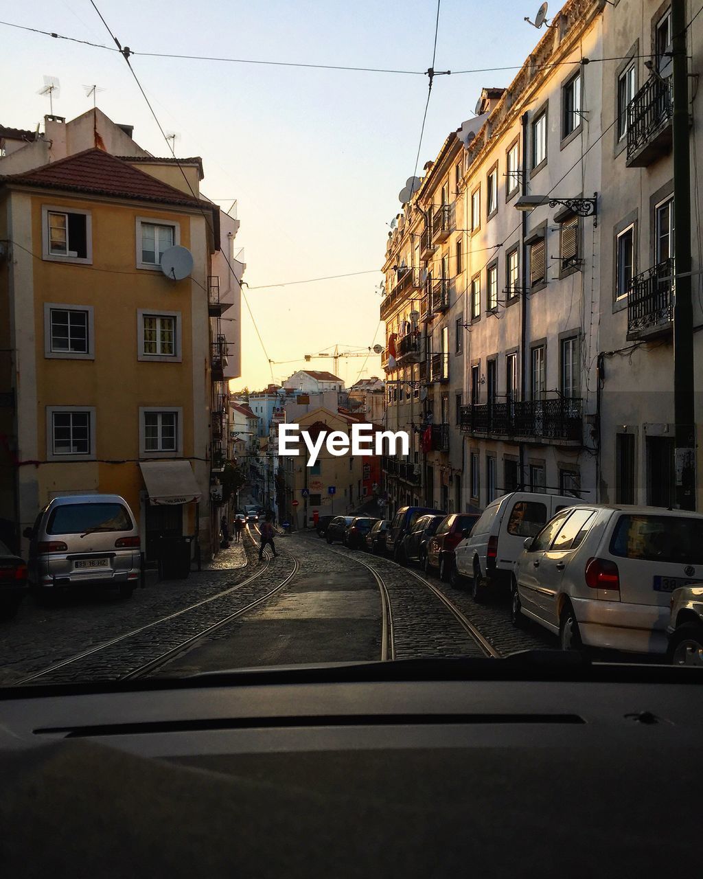 CARS PARKED ON STREET IN CITY