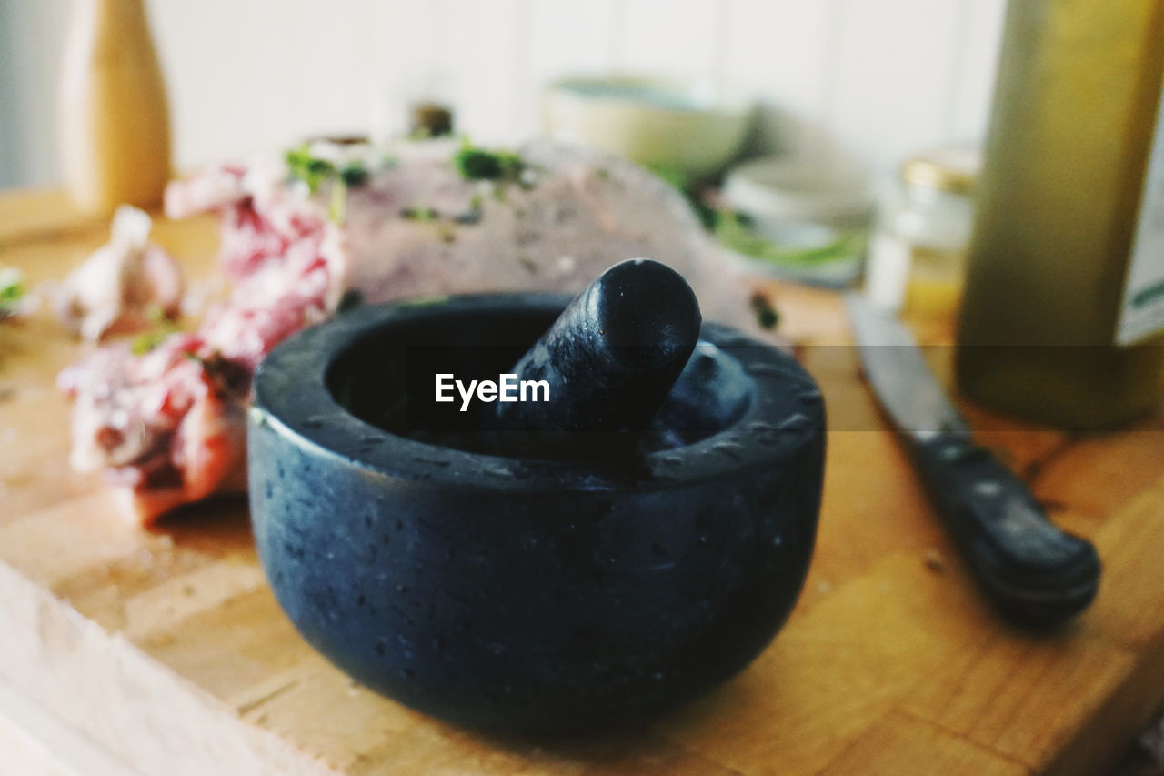 Close-up of mortar and pestle on table