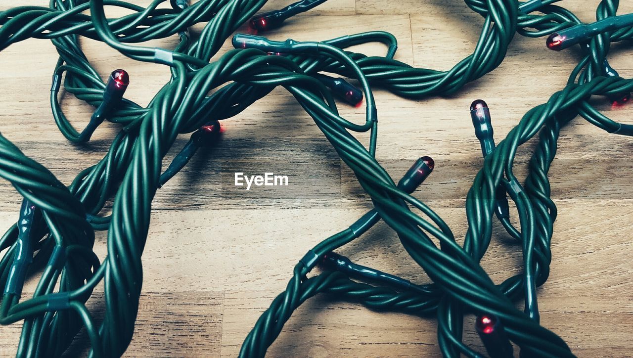 High angle view of christmas lights on wooden table