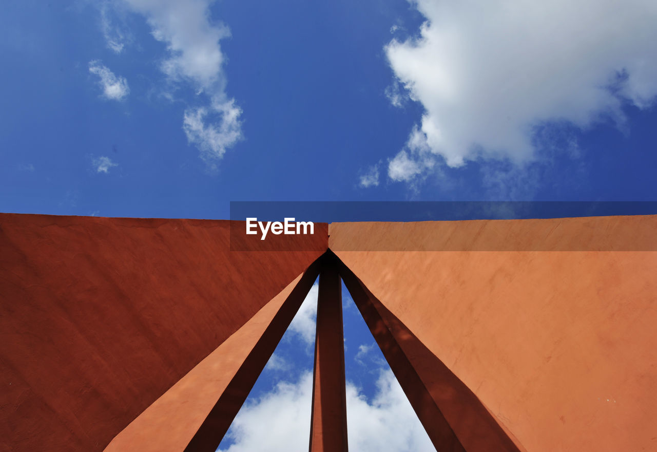 LOW ANGLE VIEW OF METALLIC STRUCTURE AGAINST SKY