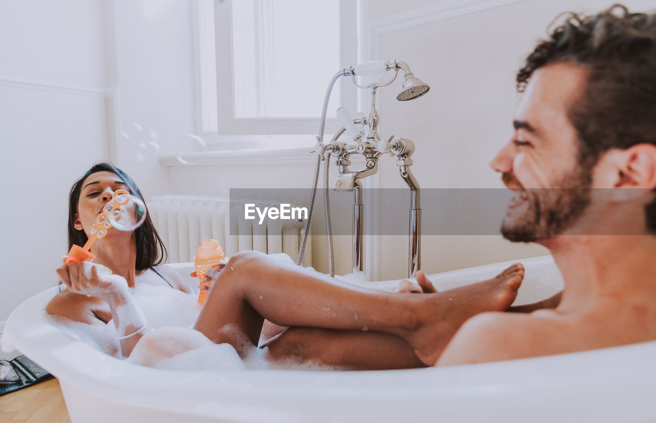 Couple sitting in bathtub