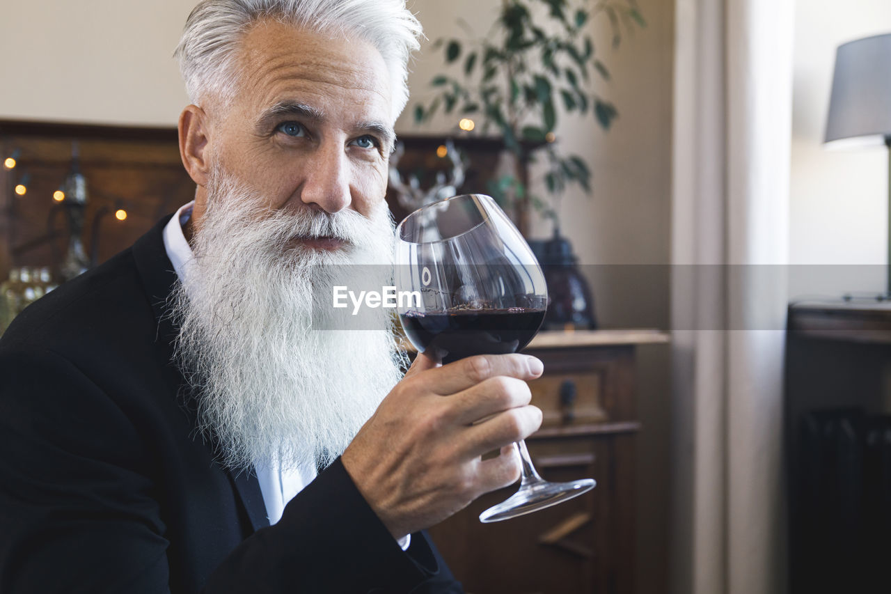 close-up of man drinking beer in cafe