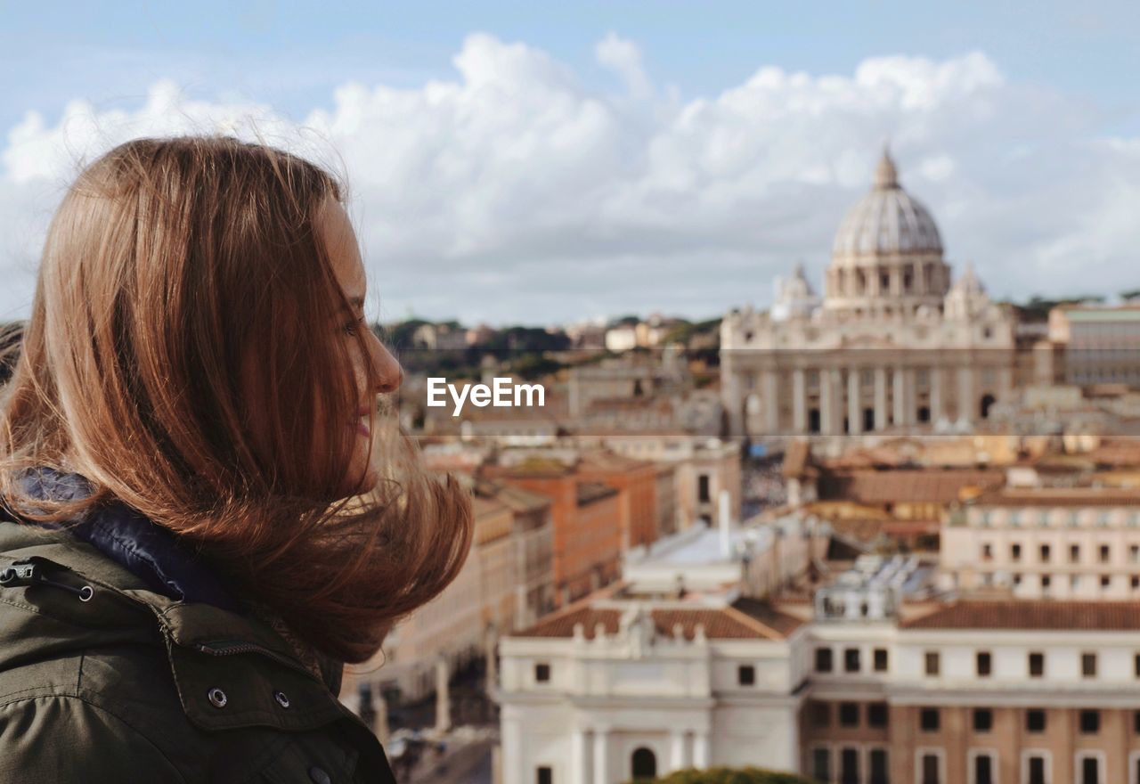 Young woman with st peters basilica in background