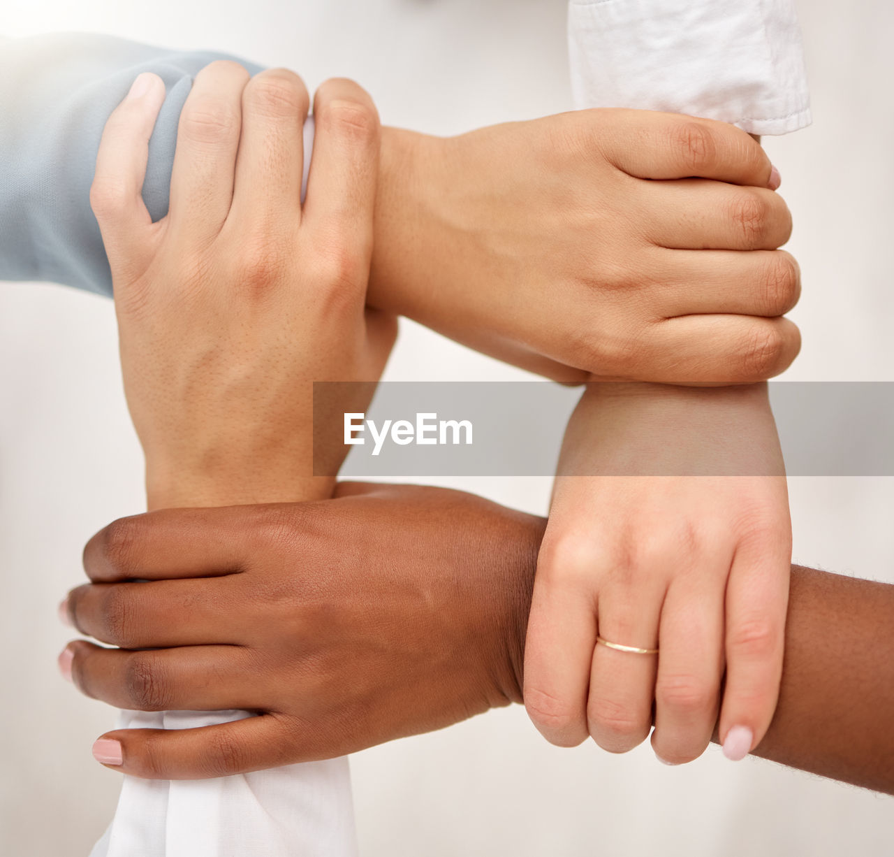 midsection of bride holding hands