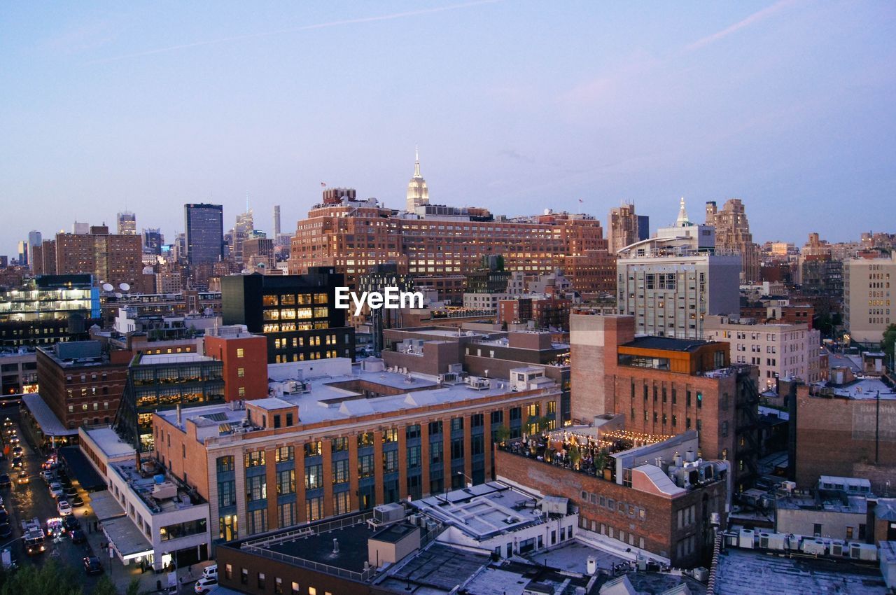 High angle view of buildings in city against sky