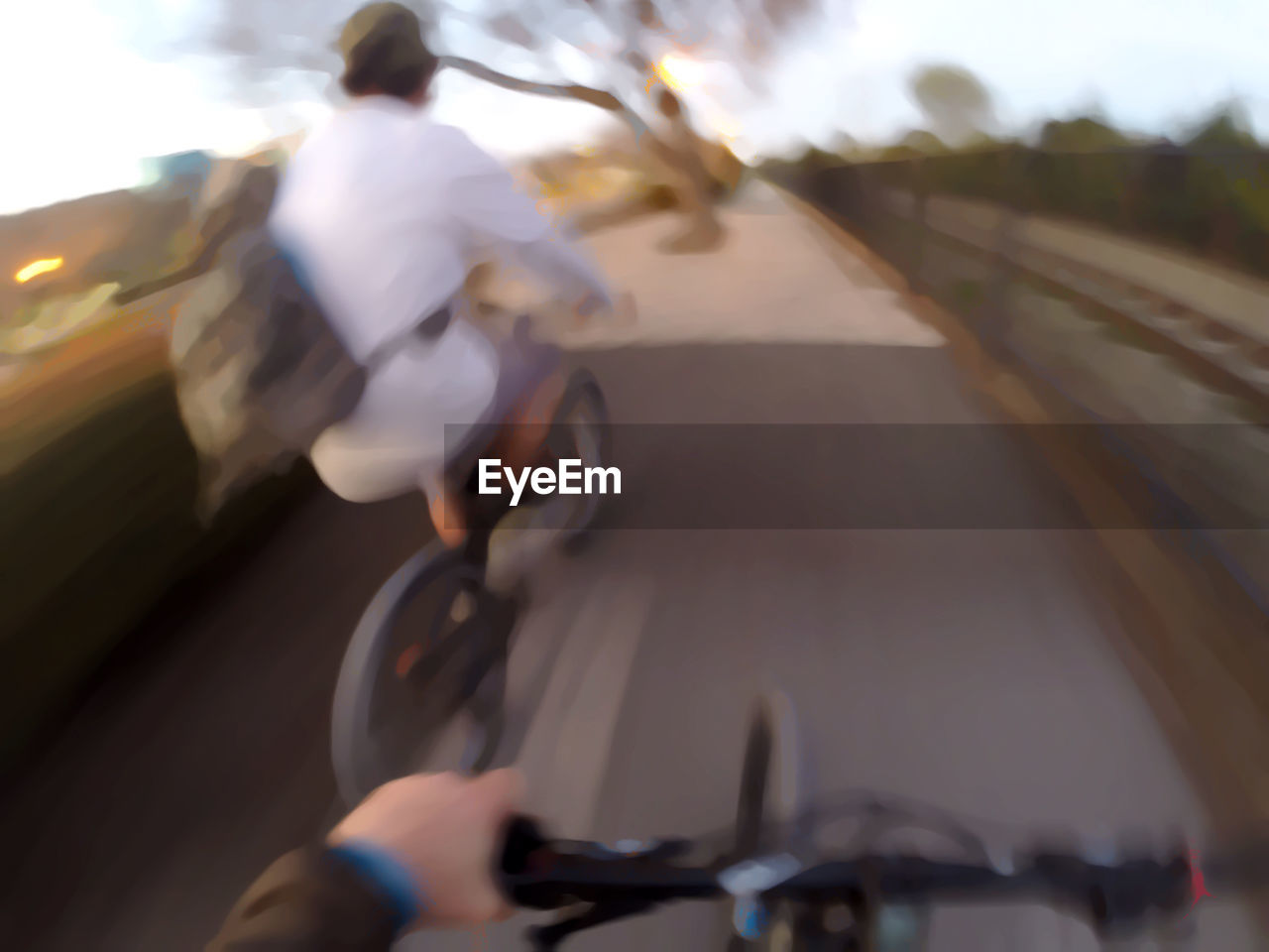 MAN CYCLING ON ROAD