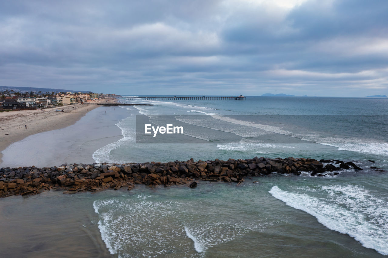 Aerial view of jetties and imperial beach pier daytime drone shot. high quality photo