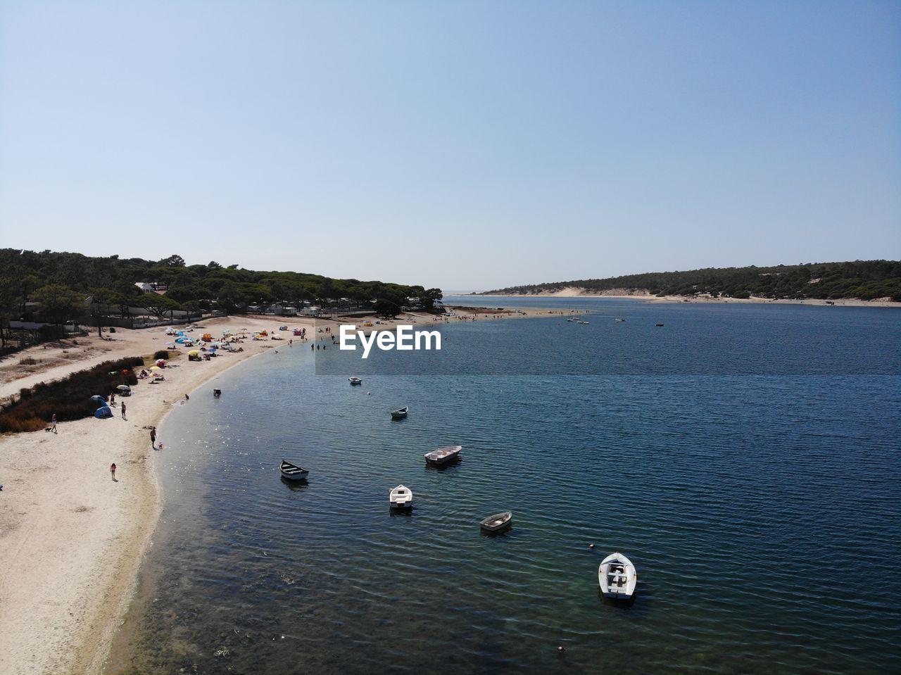 HIGH ANGLE VIEW OF SEA SHORE AGAINST CLEAR SKY