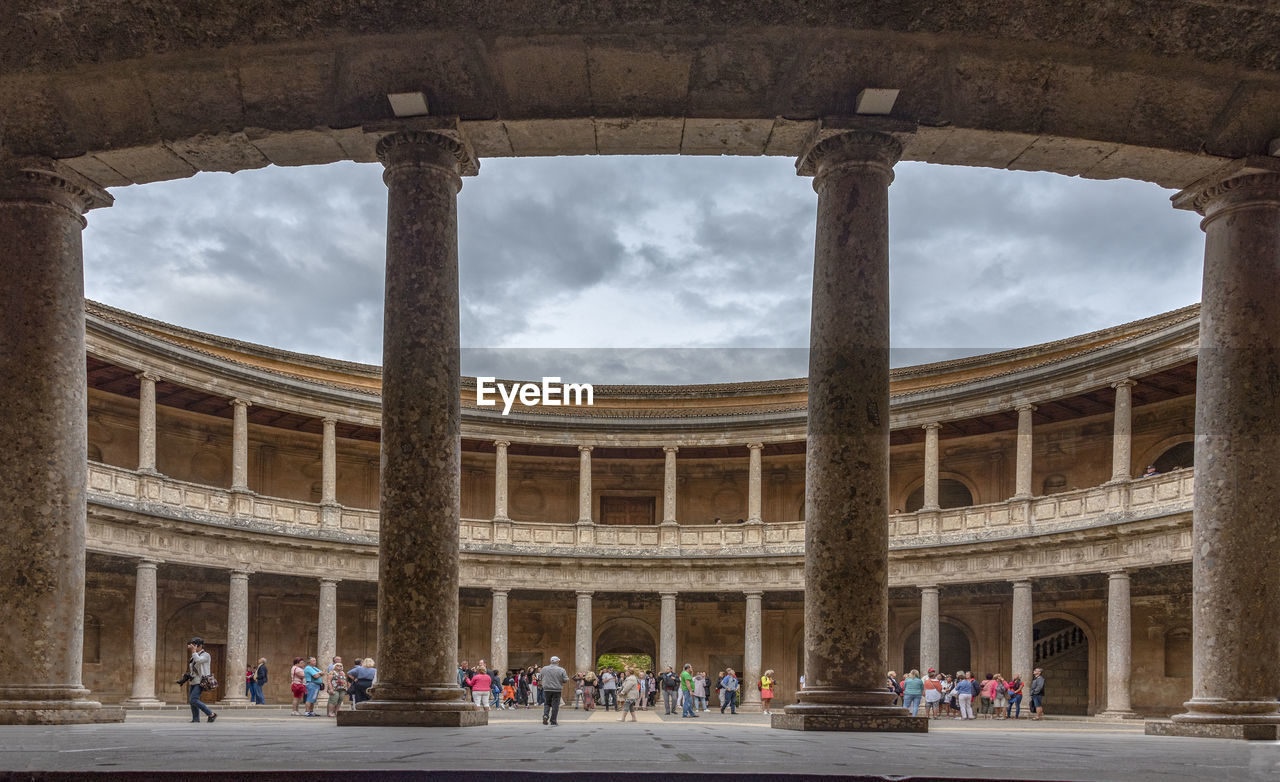 GROUP OF PEOPLE IN HISTORIC BUILDING