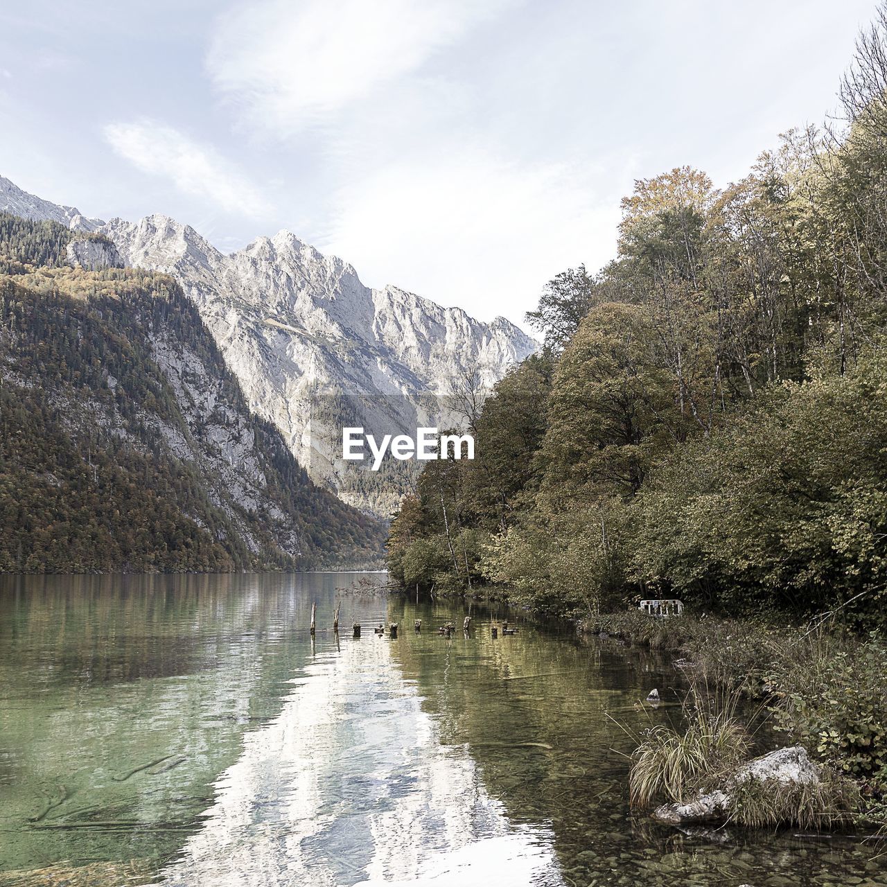 Scenic view of lake and mountains against sky