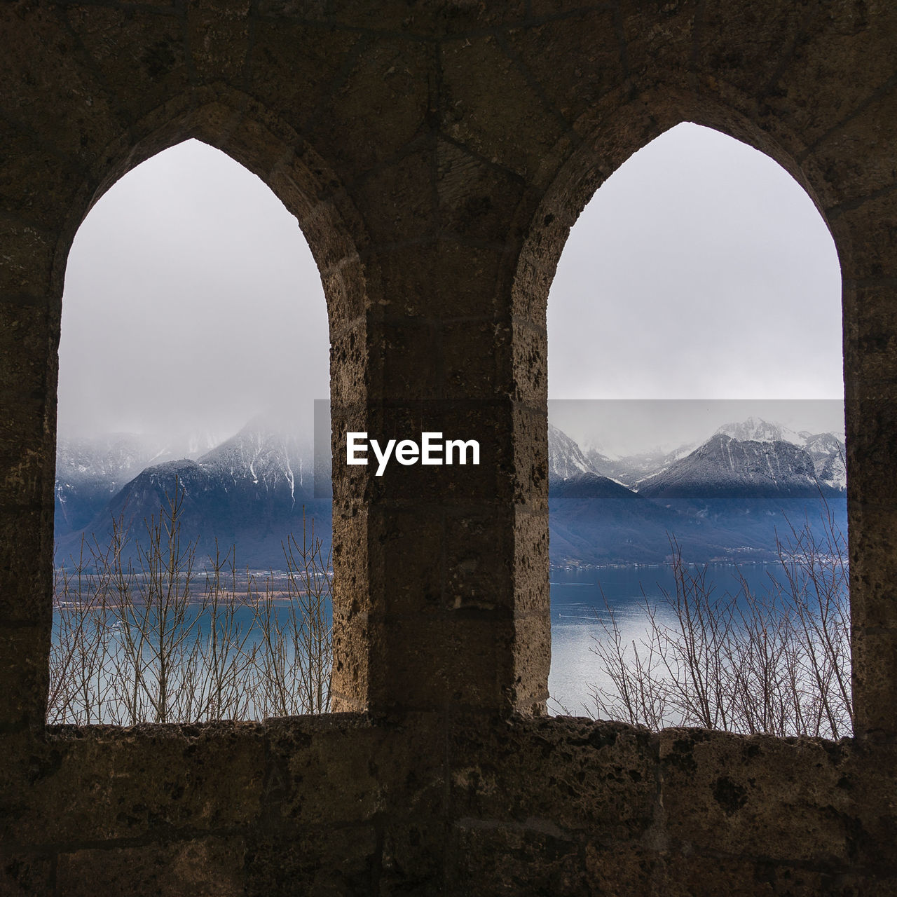 Scenic view of mountains seen through archs