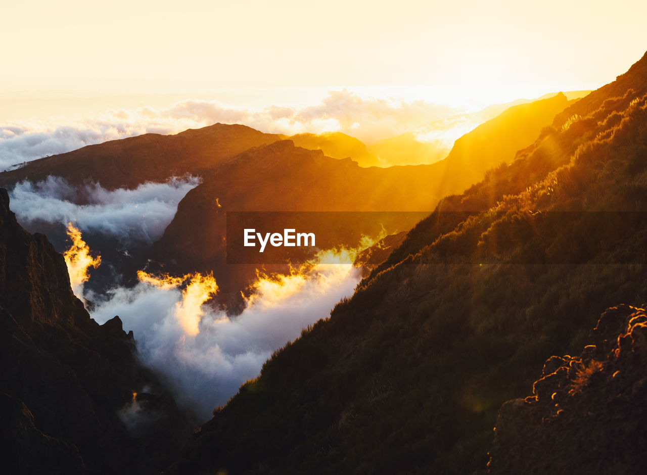 Scenic view of mountains against sky during sunset