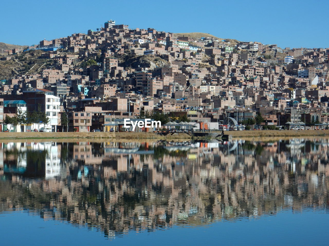 REFLECTION OF BUILDINGS IN LAKE