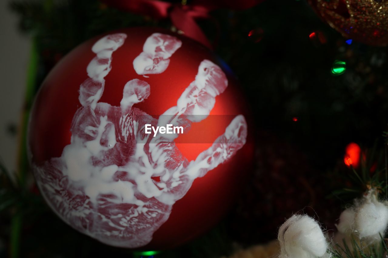 Close-up of handprint on christmas ornament