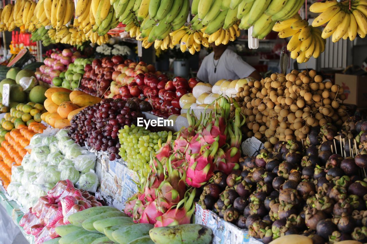 Fruits arranged at market for sale