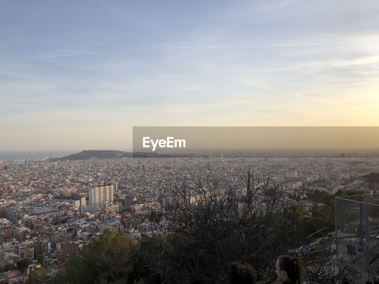 HIGH ANGLE VIEW OF ILLUMINATED CITY AGAINST SKY