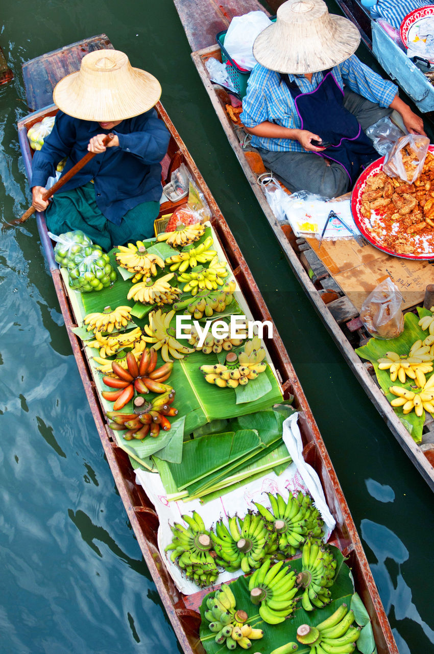 High angle view of vendors selling food at floating market