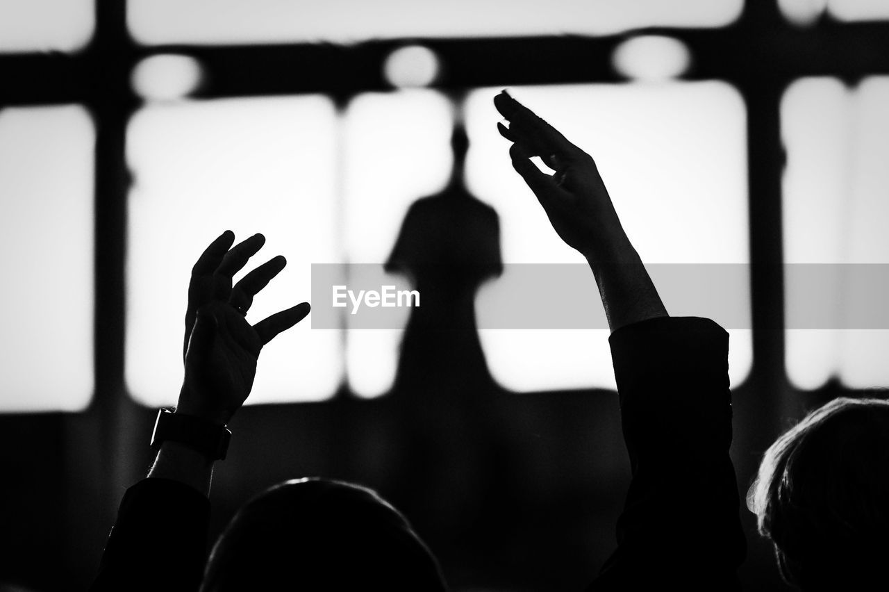 Cropped image of man with arms raised