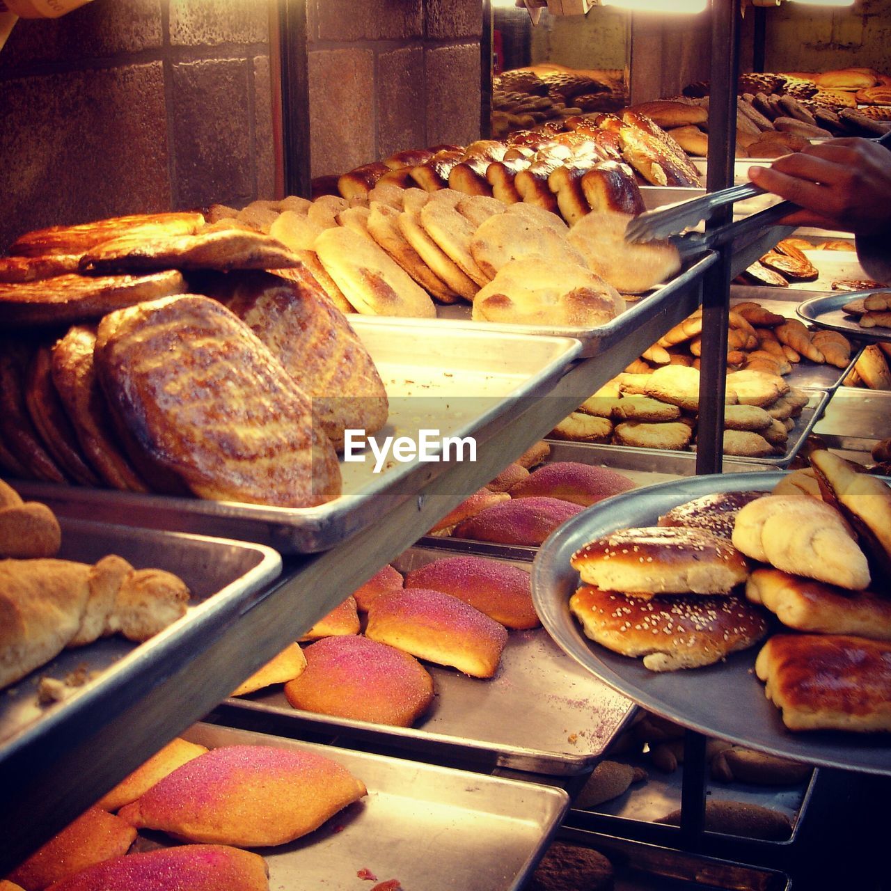 Fresh breads arranged in bakery for sale
