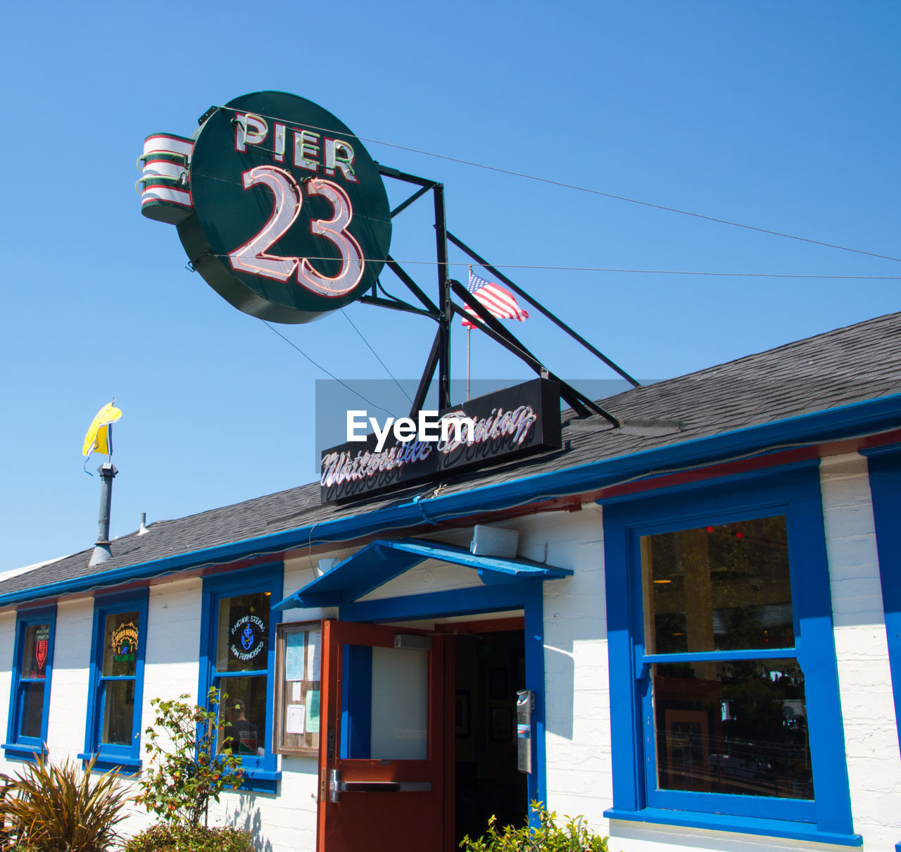 LOW ANGLE VIEW OF SIGN AGAINST BLUE SKY