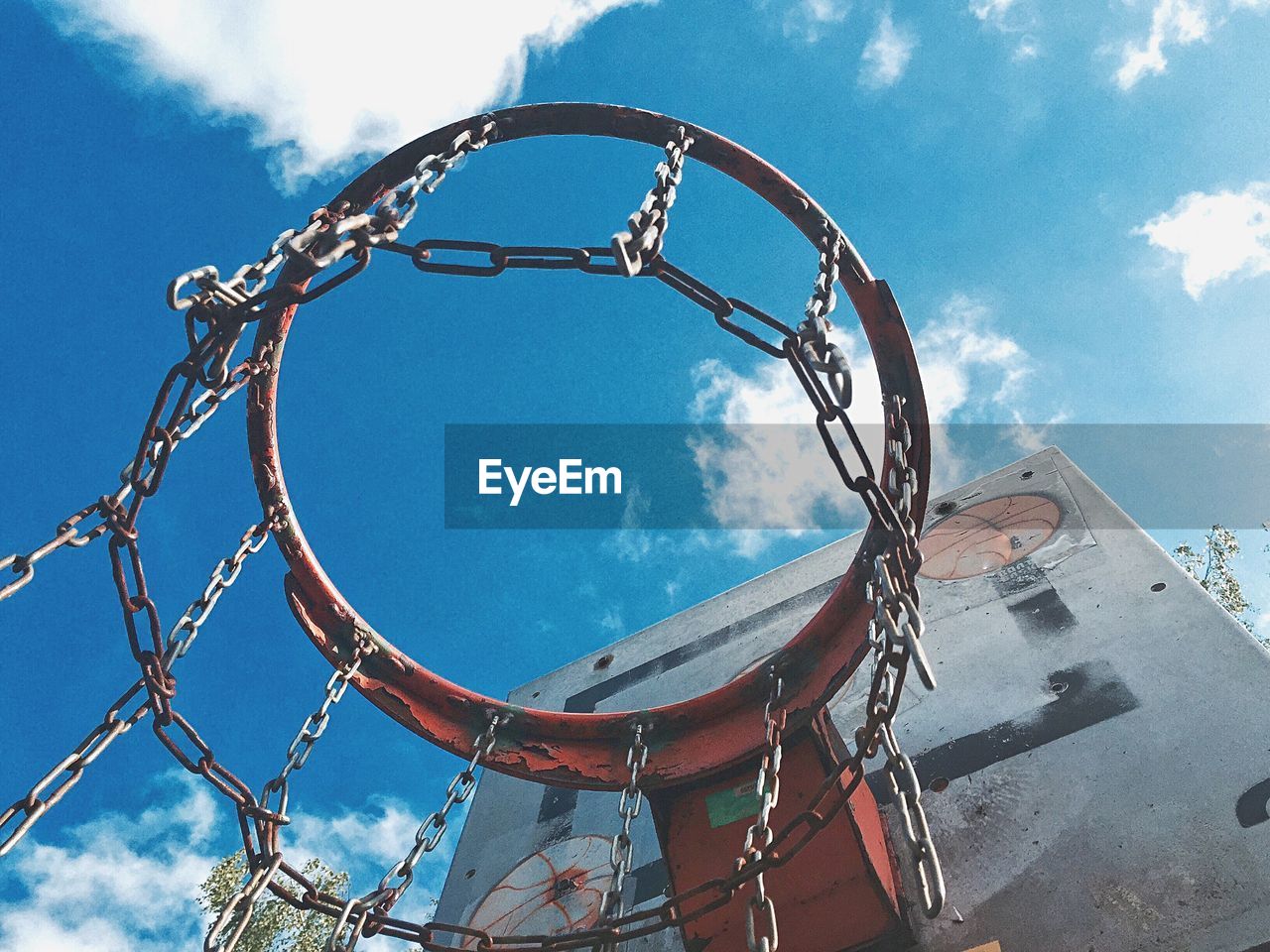 Low angle view of basketball hoop against blue sky