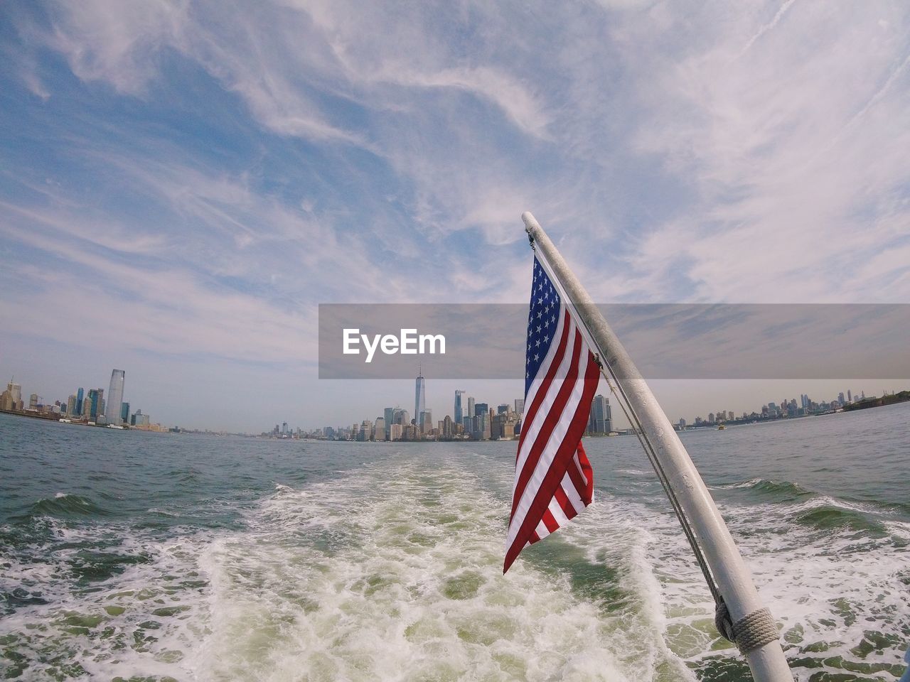 FLAG BY SEA AGAINST BUILDINGS IN CITY