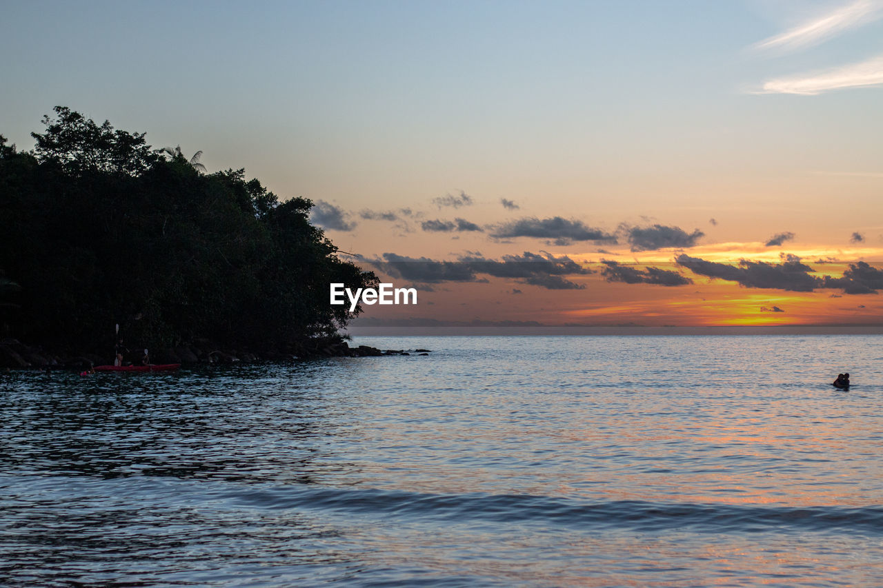 SCENIC VIEW OF SEA DURING SUNSET