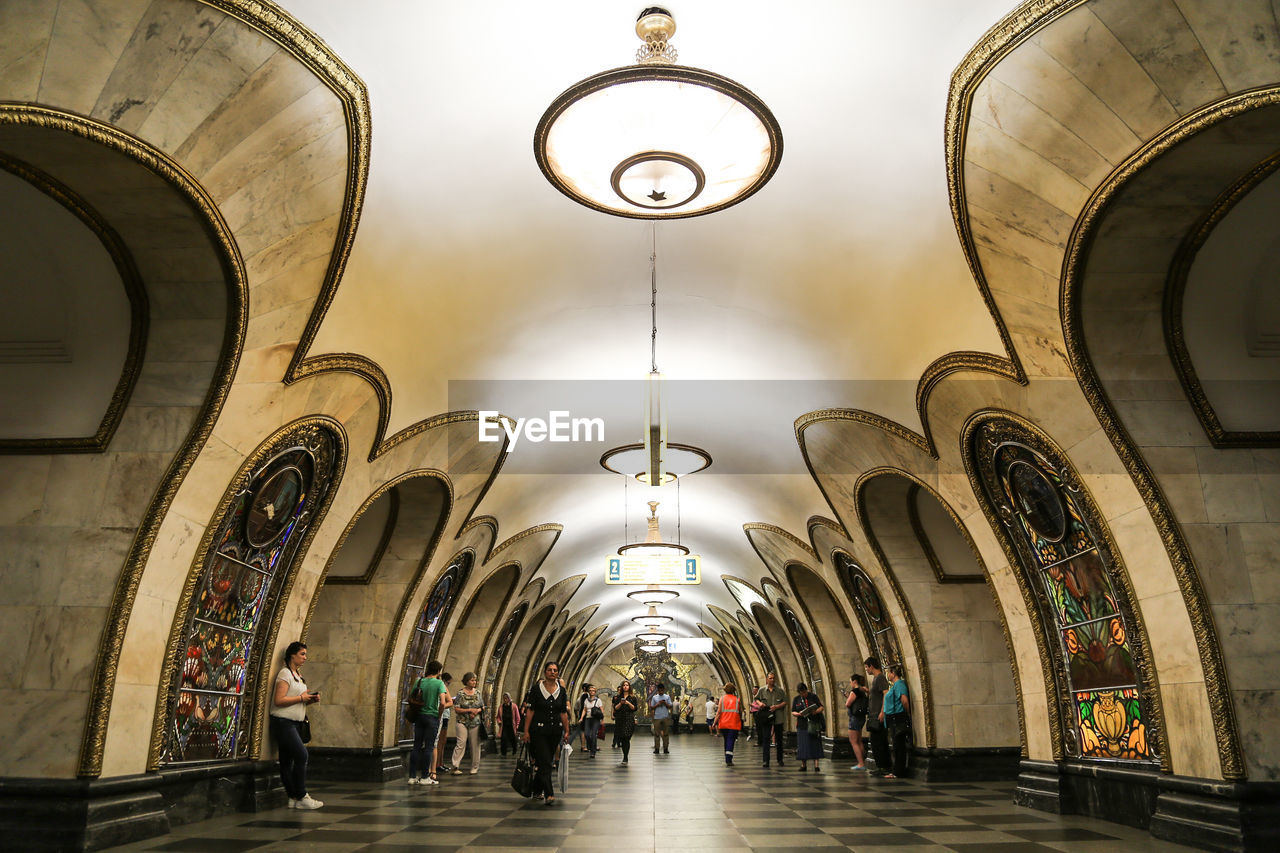 People at illuminated subway station