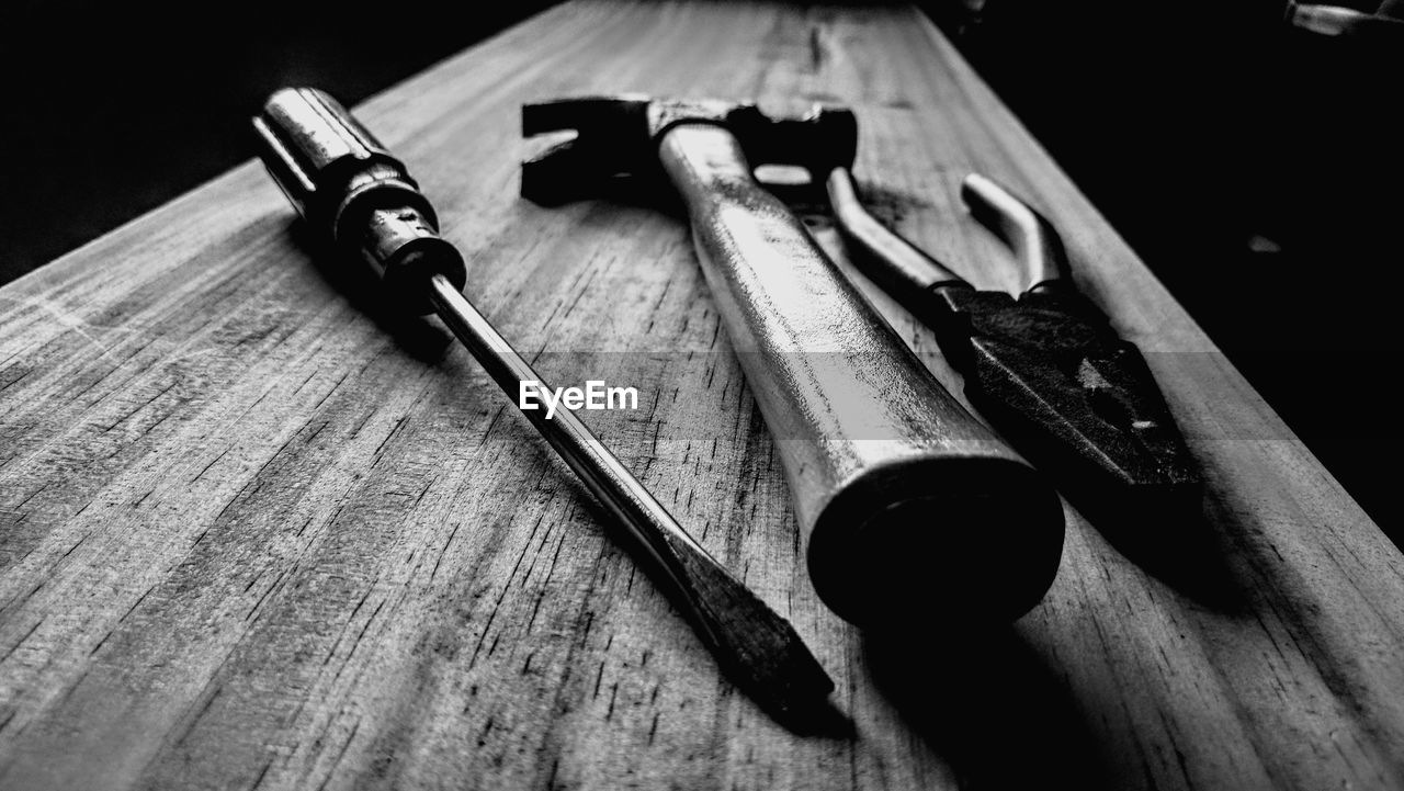 Close-up of tools on wooden table