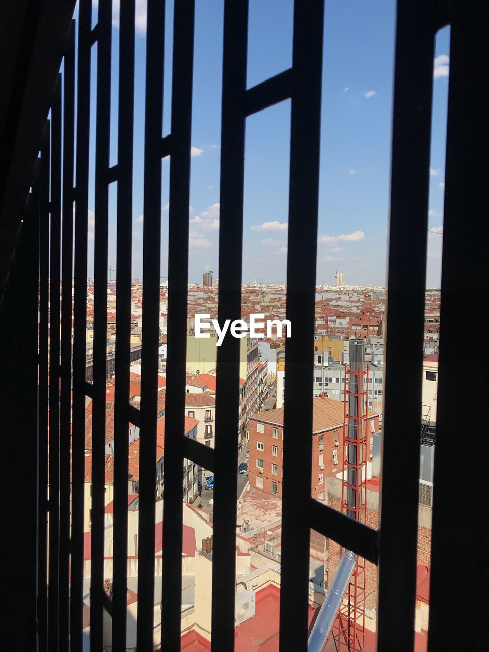 BUILDINGS SEEN THROUGH WINDOW GLASS