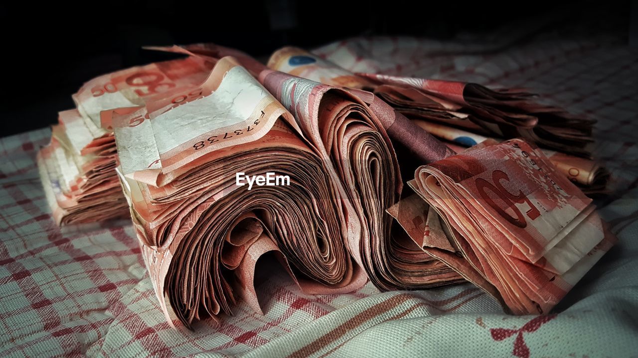 Close-up of paper currency on table