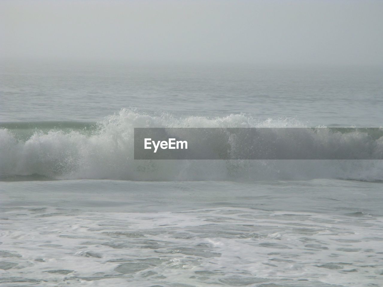 WAVES SPLASHING ON SHORE