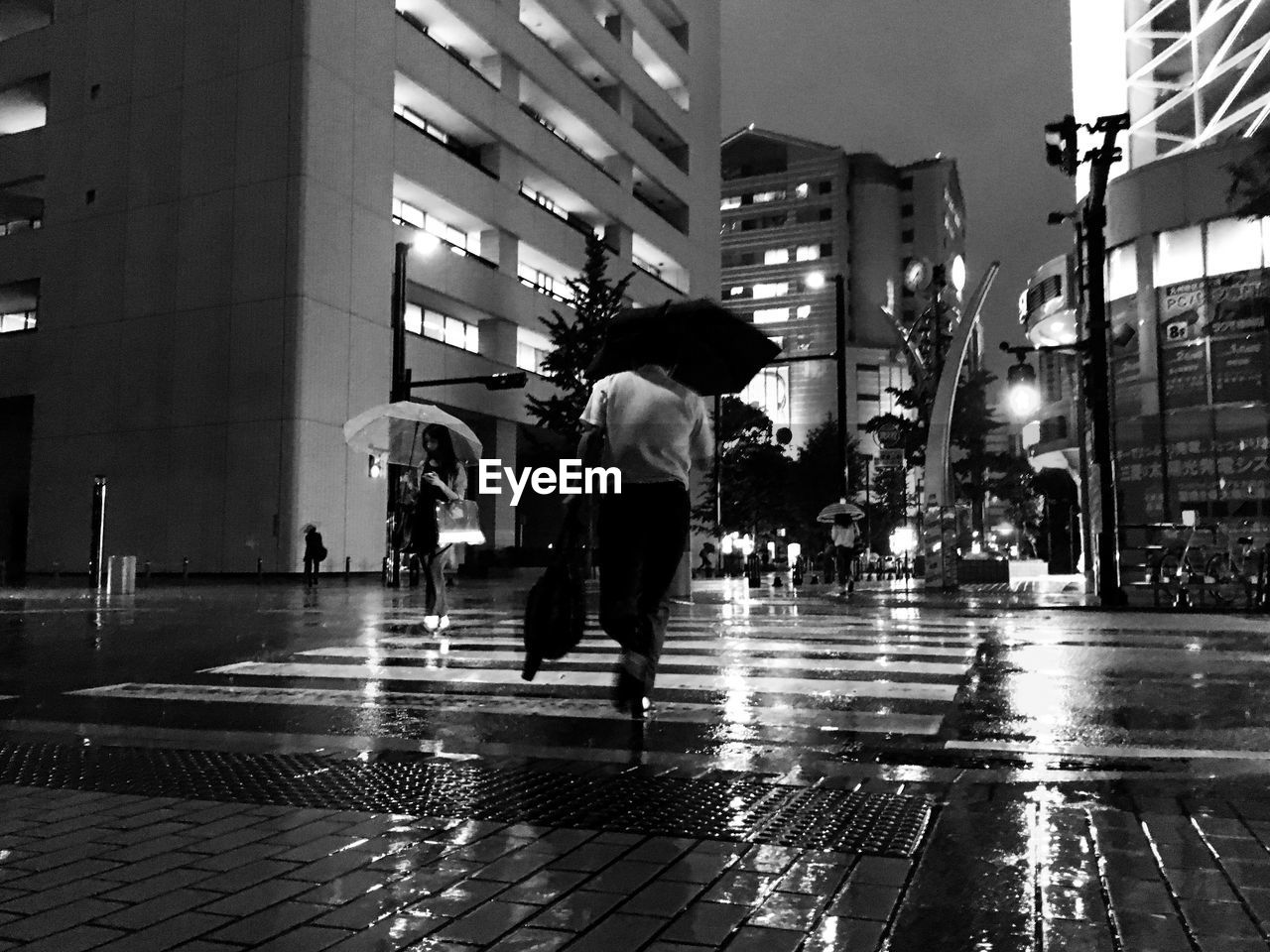 MAN WALKING ON STREET IN CITY