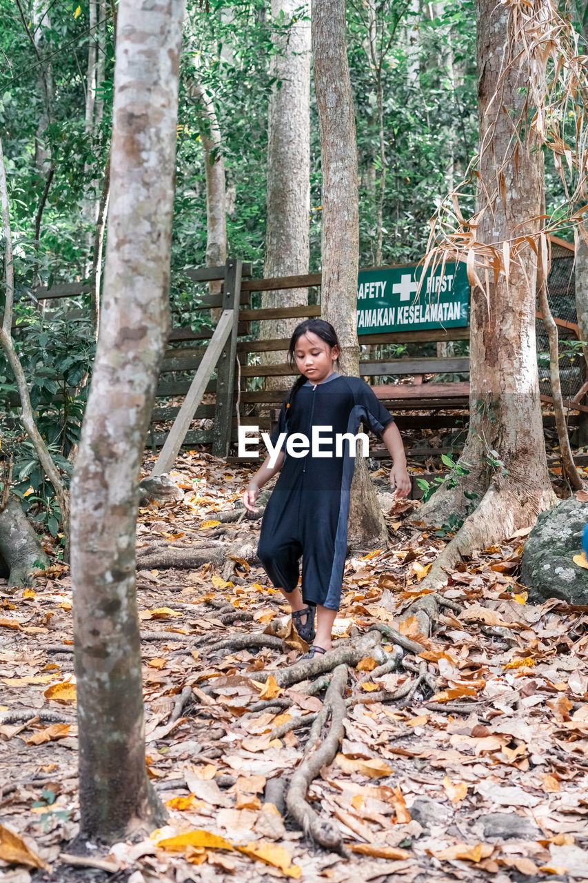 YOUNG WOMAN IN FOREST