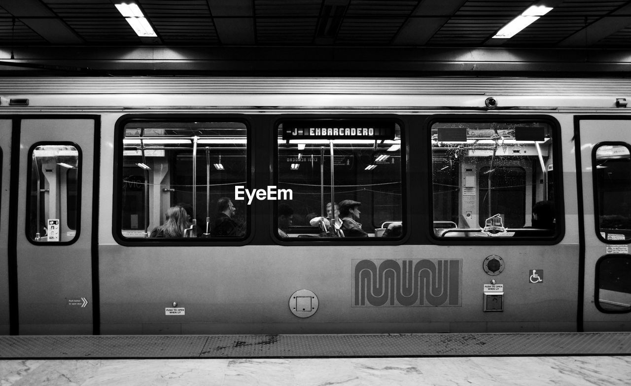 TRAIN ON RAILROAD STATION PLATFORM