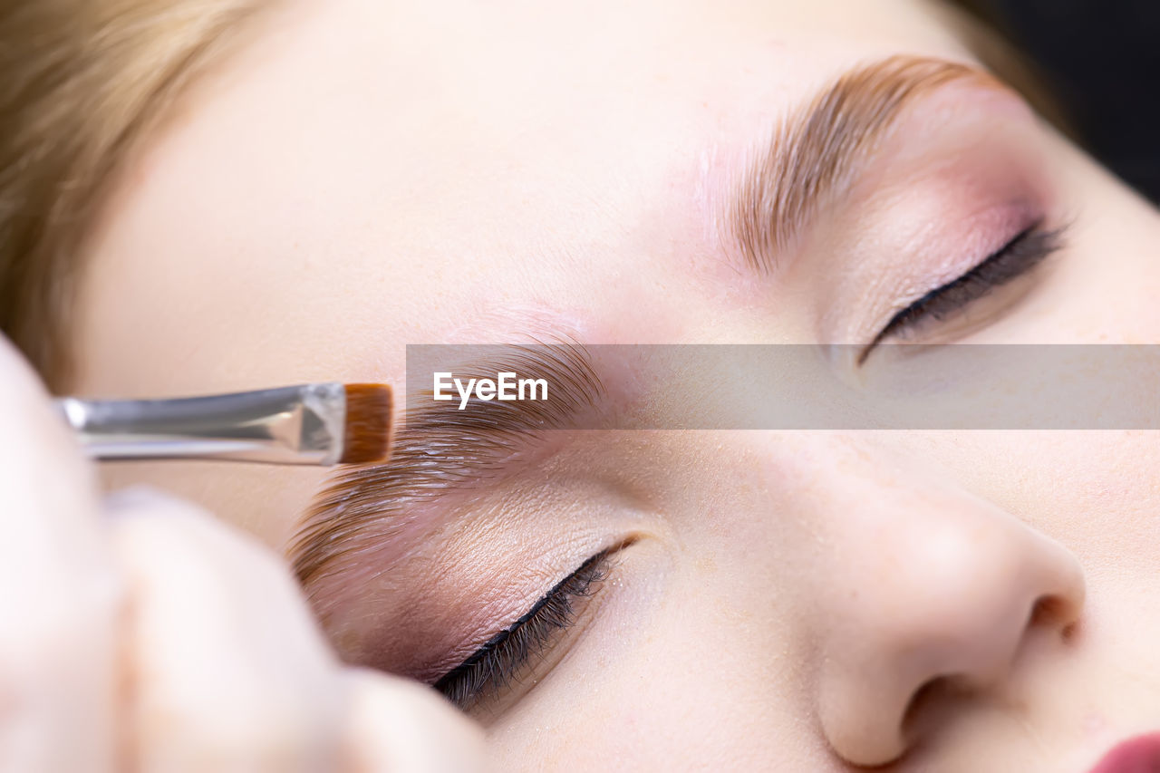 close-up of boy eating food at home