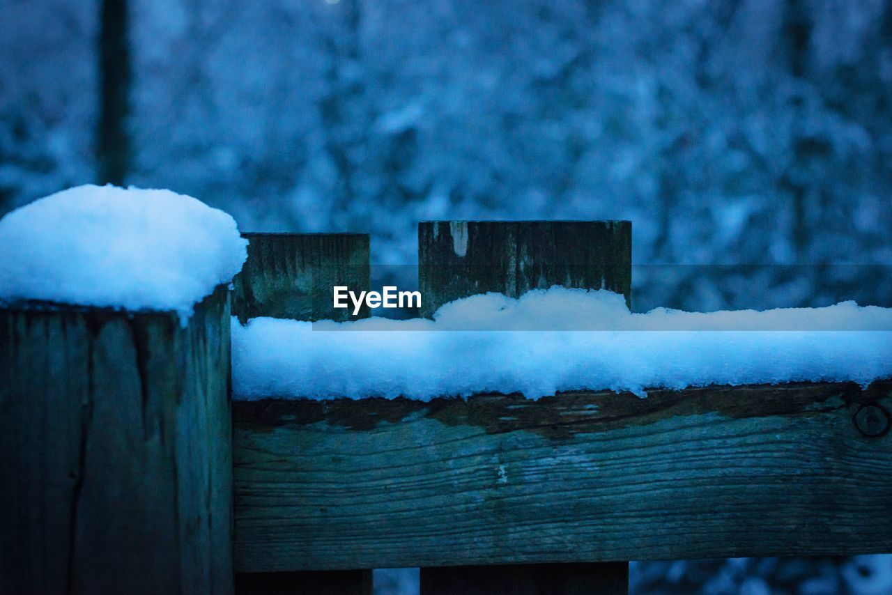 CLOSE-UP OF SNOW ON WOOD